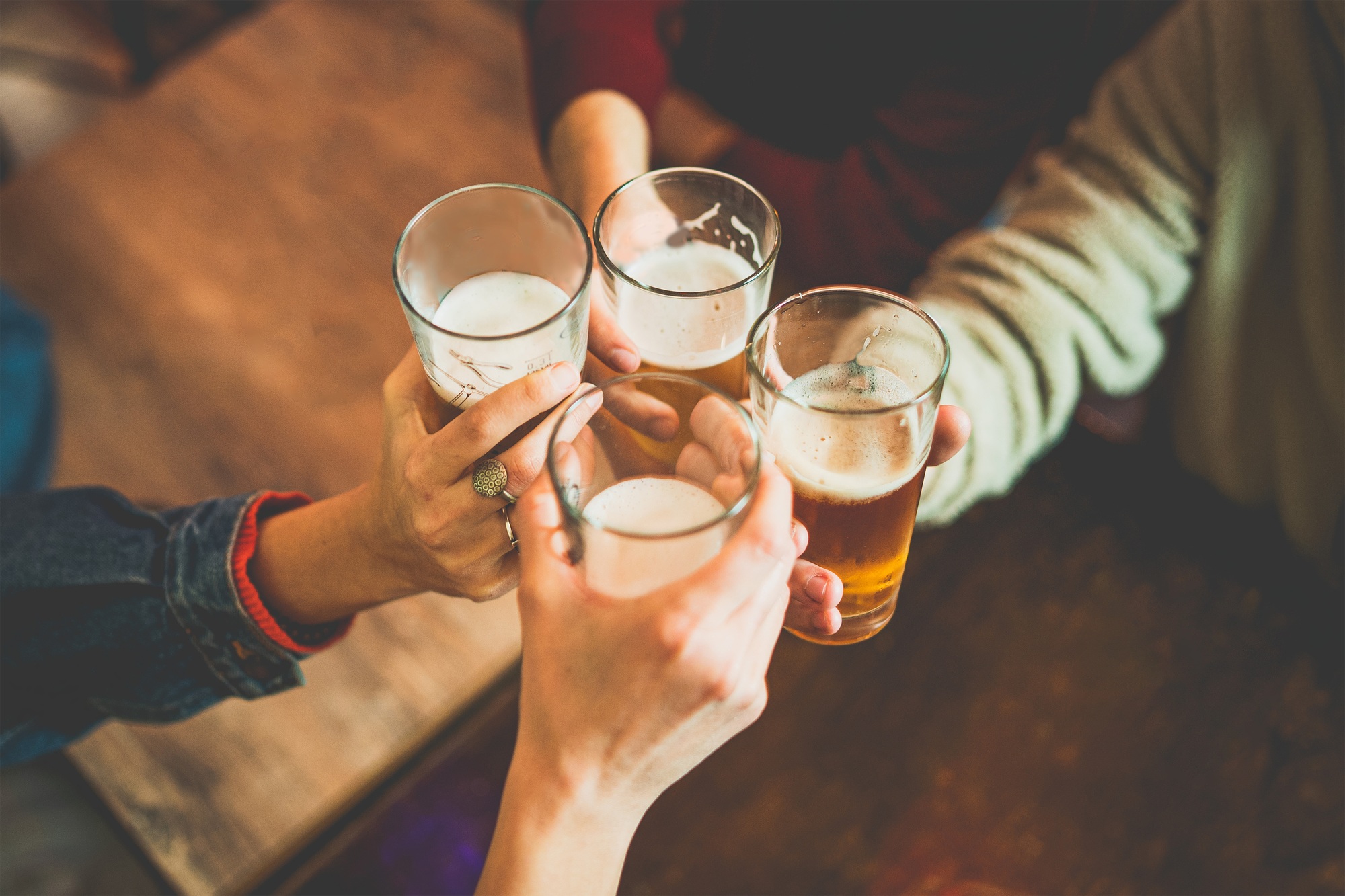 People toasting with craft beers