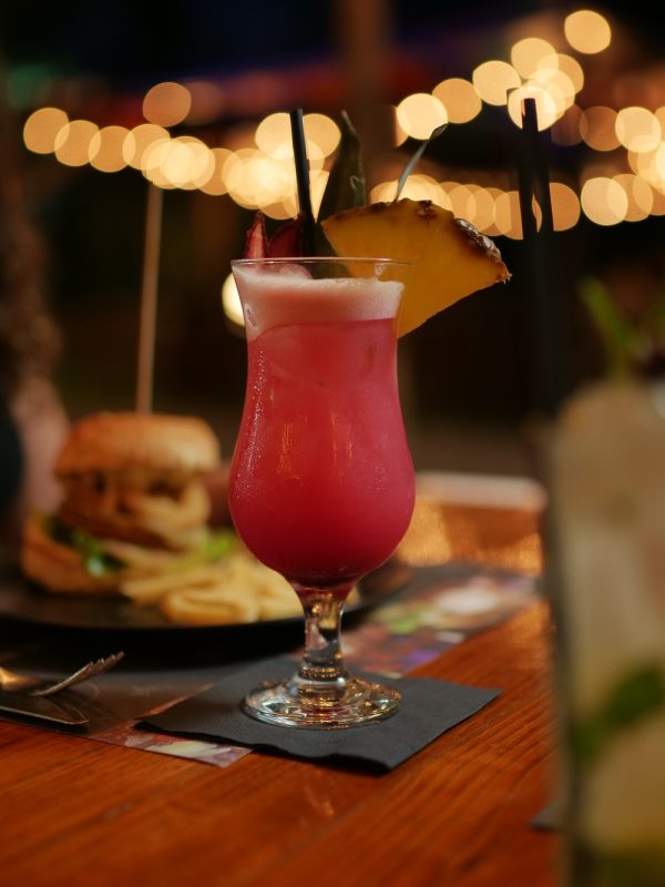 burger pub outdoor table night time cocktail